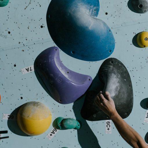 a person holding a grip on wall